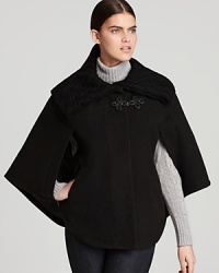When you need an refreshing update to the traditional winter coat, consider this Via Spiga cape. The knit collar locks in warmth and the silhouette puts a different spin on winter wear. When you need an refreshing update to the traditional winter coat, consider this Via Spiga cape. The knit collar locks in warmth and the silhouette puts a different spin on winter wear.