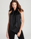 Enjoy a luxurious silhouette in a fluid Elie Tahari blouse flaunting a chic tie neck for flawless femininity.