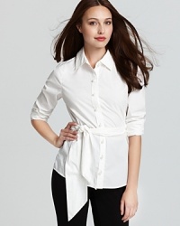 A statement tie belt gives the classic Vineyard Vines shirt a feminine update, flattering your curves while flaunting your chic style sense. A statement tie belt gives the classic Vineyard Vines shirt a feminine update, flattering your curves while flaunting your chic style sense.