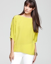 Look smart and chic in a Vince silk top, popping up in a sprightly neon hue. Look smart and chic in a Vince silk top, popping up in a sprightly neon hue.