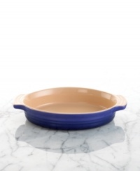 Prepare everything from peach cobbler to macaroni and cheese in this durable stoneware dish. Its practical shape and innovative surface goes from freezer to oven or microwave to the table for serving. Resists stains, cracks and odor retention. Side handles. Prepare everything from peach cobbler to macaroni and cheese in this durable stoneware dish. Its practical shape and innovative surface goes from freezer to oven or microwave to the table for serving. Resists stains, cracks and odor retention. Side handles.