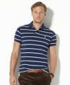 Sleek horizontal stripes lend a crisp, polished look to a relaxed-fitting polo shirt in breathable cotton mesh.