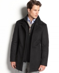 A minimalist, mid-length coat designed with the restraint and understated luxury that distinguishes the BOSS Black label of Hugo Boss. A minimalist, mid-length coat designed with the restraint and understated luxury that distinguishes the BOSS Black label of Hugo Boss.