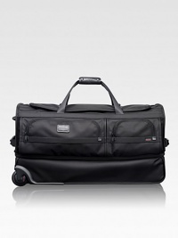 This roomy wheeled duffel is ideal for recreational and adventure travelers, whether traveling alone or as a pair. The durable ballistic nylon design features a separate bottom section perfect for gear, boots, shoes or clothing you want to keep separate. Zip closure Carry handles and telescoping handle Exterior zip pockets Interior organizing pockets FXT ballistic nylon 15½W X 29H X 14D Imported This roomy wheeled duffel is ideal for recreational and adventure travelers, whether traveling alone or as a pair. The durable ballistic nylon design features a separate bottom section perfect for gear, boots, shoes or clothing you want to keep separate. Zip closure Carry handles and telescoping handle Exterior zip pockets Interior organizing pockets FXT ballistic nylon 15½W X 29H X 14D Imported