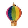 This glass Moonshine ornament is delightfully decorated in iridescent glitter in the colors of the rainbow.