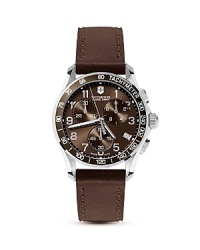A stylish brown dial with three-eye functionality and chronograph movement is offset by gleaming stainless steel and a luxe leather strap in this contemporary timepiece from Victorinox. A stylish brown dial with three-eye functionality and chronograph movement is offset by gleaming stainless steel and a luxe leather strap in this contemporary timepiece from Victorinox.