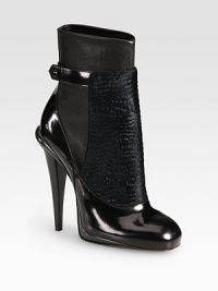 Glossy patent leather, ultra-soft calf hair and matte leather form this tall silhouette hitting above the ankle. Stacked heel, 4½ (115mm)Calf hair, leather and patent leather upperPatent leather strap with snap closureLeather lining and solePadded insoleMade in Italy Glossy patent leather, ultra-soft calf hair and matte leather form this tall silhouette hitting above the ankle. Stacked heel, 4½ (115mm)Calf hair, leather and patent leather upperPatent leather strap with snap closureLeather lining and solePadded insoleMade in Italy