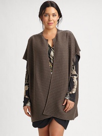 Offering a flattering relaxed fit, this wool vest features classic ribbing. Pair this muted cocoon design with a printed top or dress.Open-front designShort sleevesAbout 32 from shoulder to hemWoolDry cleanMade in Italy Offering a flattering relaxed fit, this wool vest features classic ribbing. Pair this muted cocoon design with a printed top or dress.Open-front designShort sleevesAbout 32 from shoulder to hemWoolDry cleanMade in Italy