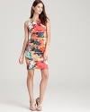 Beautiful brushstroked blooms thrive on this fitted Calvin Klein sheath, designed in a modern paneled construction.
