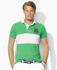 A short-sleeved, trim-fitting rugby is crafted from breathable cotton mesh with a pieced stripe and sporty patchwork for a modern, athletic look. A short-sleeved, trim-fitting rugby is crafted from breathable cotton mesh with a pieced stripe and sporty patchwork for a modern, athletic look.
