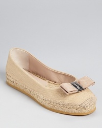 Salvatore Ferragamo does casual-cool--these chic espadrille flats offer style and high-class comfort in a perfectly summery package. Salvatore Ferragamo does casual-cool--these chic espadrille flats offer style and high-class comfort in a perfectly summery package.