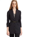 THE LOOKNotched collar Three button front ¾ sleeves with five button cuffs Single welt pocket at chest Leather belt with buckle and belt loopsTHE FITAbout 28 from shoulder to hemTHE MATERIAL96% wool/4% Lycra spandex Fully linedCARE & ORIGINDry clean Imported