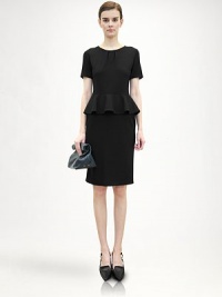 Equal parts ladylike and modern, this impeccably tailored wool style features soft pleats at the neckline and a ruffled, feminine peplum.Pleated jewel necklineShort raglan sleevesRuffled peplumConcealed back zipWoolDry cleanMade in ItalyModel shown is 5'11 (180cm) wearing US size 4. Equal parts ladylike and modern, this impeccably tailored wool style features soft pleats at the neckline and a ruffled, feminine peplum.Pleated jewel necklineShort raglan sleevesRuffled peplumConcealed back zipWoolDry cleanMade in ItalyModel shown is 5'11 (180cm) wearing US size 4.