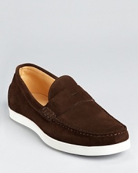 Penny loafers rendered in quality suede and updated with modern, sporty details for a wear-anywhere casual shoe. Penny loafers rendered in quality suede and updated with modern, sporty details for a wear-anywhere casual shoe.