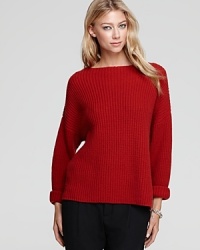 A classic boat neckline and allover ribbed-knit design enrich this soft Vince sweater this season. A classic boat neckline and allover ribbed-knit design enrich this soft Vince sweater this season.