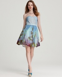 Imbued with a painterly floral print, this Aidan Mattox dress boasts a structured retro silhouette complete with waist-cinching belt. Imbued with a painterly floral print, this Aidan Mattox dress boasts a structured retro silhouette complete with waist-cinching belt.
