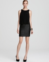 Laser cut dots lend texture to a fitted skirt on Aidan Mattox's blouson-bodiced little black dress. Laser cut dots lend texture to a fitted skirt on Aidan Mattox's blouson-bodiced little black dress.