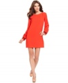 Make a bold soiree statement in this hot-hued RACHEL Rachel Roy shift dress with beaded cuffs for a hint of shine!