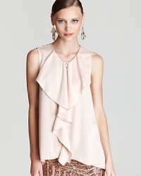 A dramatic cascade of ruffles descends the front of this silky-light BCBGMAXAZRIA blouse for an oh-so feminine look that adds polish and allure to your wardrobe. A dramatic cascade of ruffles descends the front of this silky-light BCBGMAXAZRIA blouse for an oh-so feminine look that adds polish and allure to your wardrobe.