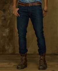 A classic slim-fitting jean looks sleek and modern in dark-washed indigo denim, finished with light whiskering and subtle rips for a vintage effect. A classic slim-fitting jean looks sleek and modern in dark-washed indigo denim, finished with light whiskering and subtle rips for a vintage effect.