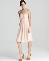 This ladylike French Connection dress is subtly seductive with a strapless neckline and low cut back. Wear it to an evening affair, or toss on a cardigan for a beautiful business lunch look.