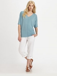 A touchable design made from soft linen, this top features a feminine v-neckline, modern dolman sleeves and a relaxed-yet-flattering fit. V-neckElbow-length sleevesFront and back seamPull-on styleAbout 26 from shoulder to hemLinenHand washImported Model shown is 5'10 (177cm) wearing US size Small. 