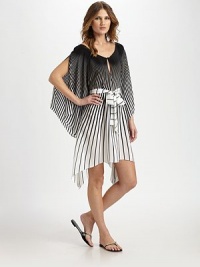 A classic black and white design with contrasting stripe details and a fluid silhouette.Jewel necklineKeyhole detailDolman sleevesPull-on styleSelf-tieSilkHand washImported A classic black and white design with contrasting stripe details and a fluid silhouette.Jewel necklineKeyhole detailDolman sleevesPull-on styleSelf-tieSilkHand washImported