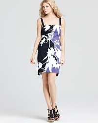 Whiteout florals pop from the sleek silhouette of this T Tahari dress. Top off the style with a leather jacket for a tough take on femininity. Whiteout florals pop from the sleek silhouette of this T Tahari dress. Top off the style with a leather jacket for a tough take on femininity.