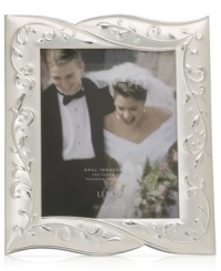Showcase your treasured memories with a true treasure! The Opal Innocence frame features a delicate vine pattern accented by matte and polished silver. Showcase your treasured memories with a true treasure! The Opal Innocence frame features a delicate vine pattern accented by matte and polished silver.