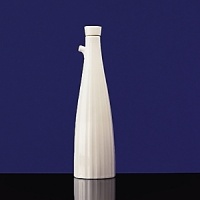 Simple shapes of crisp white are accented with precisely etched lines. Contrasting black matte jasper accessories with glazed interiors are also available. Bone china. Simple shapes of crisp white are accented with precisely etched lines. Contrasting black matte jasper accessories with glazed interiors are also available. Bone china.