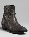 A sparkling finish and gunmetal skull studs give these edgy Zadig & Voltaire booties glam-meets-gothic presence.