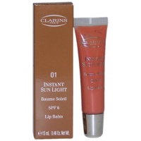 Instant Sun Light Lip Balm SPF 6 No 1 Sunset Bronze By Clarins for Women, 0.46 Ounce Instant Sun Light Lip Balm SPF 6 No 1 Sunset Bronze By Clarins for Women, 0.46 Ounce