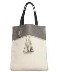 Rock the colorblock trend with this tall tote design from Carlos by Carlos Santana. Ultra-sleek and outfitted with zipper and tassel accents, it's practically posed to meet all your daily demands.