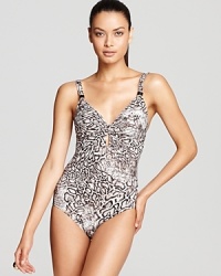 With a keyhole cutout and deep scoop back, Carmen Marc Valvo's snake print maillot is decidedly warm-blooded. With a keyhole cutout and deep scoop back, Carmen Marc Valvo's snake print maillot is decidedly warm-blooded.