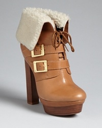 Be the bomb in these bomber-jacket style Rachel Zoe booties. Golden buckles and plush shearling add luxe touches. Be the bomb in these bomber-jacket style Rachel Zoe booties. Golden buckles and plush shearling add luxe touches.