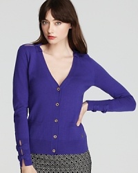 Cinched with bows, dramatic slits at the sleeves and center back lend provocative edge to this Juicy Couture sweater for an alluring style choice. Cinched with bows, dramatic slits at the sleeves and center back lend provocative edge to this Juicy Couture sweater for an alluring style choice.