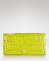 Croc-embossed leather lends chic texture to this bifold continental wallet from Longchamp.