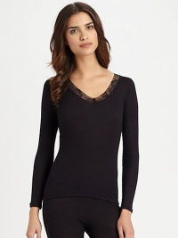 This warm winter layering piece is practical and beautiful with elegant, semi-sheer tulle lace. V-neckTulle lace trim at necklineLong sleevesRibbed bodyBody: 70% wool/30% silkLace: 90% polyamide/10% elastaneMachine washImported This warm winter layering piece is practical and beautiful with elegant, semi-sheer tulle lace. V-neckTulle lace trim at necklineLong sleevesRibbed bodyBody: 70% wool/30% silkLace: 90% polyamide/10% elastaneMachine washImported