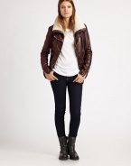 Supple leather shapes a fitted bomber jacket with knit trim and a dyed shearling collar. Dyed shearling collarDual asymmetrical zippersLong sleeves with zip cuffsZippered slash pocketsFully linedAbout 24 from shoulder to hemBody: LeatherTrim: Wool/acrylicFur trim: Dyed shearlingDry clean with leather specialistImportedFur origin: South AfricaModel shown is 5'10 (177cm) wearing US size 4.