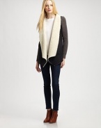 Modern take on the classic coat, this suede like design is styled with contrasting knit sleeves and plush faux shearling trim. Faux shearling shawl collarLong knit sleevesAdjustable back cordFaux shearling liningBody: PolyesterTrim: 50% acrylic/30% wool/20% nylonHand washImportedModel shown is 5'10 (177cm) wearing US size Small.
