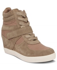 Pump up the volume on your athletic wear with Steve Madden's Olympiaa wedge sneakers. They feature chunky laces and a Velcro strap that wraps across the vamp. Pump up the volume on your athletic wear with Steve Madden's Olympiaa wedge sneakers. They feature chunky laces and a Velcro strap that wraps across the vamp.