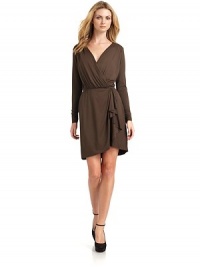 THE LOOKSurplice V-neckDraped ruffle detail along front skirtPullover styleTHE FITAbout 33 from shoulder to hemTHE MATERIALBody: 92% viscose/8% spandexTrim: tencelCARE & ORIGINMachine washMade in USAModel shown is 5'9½ (176cm) wearing US size Small. THE LOOKSurplice V-neckDraped ruffle detail along front skirtPullover styleTHE FITAbout 33 from shoulder to hemTHE MATERIALBody: 92% viscose/8% spandexTrim: tencelCARE & ORIGINMachine washMade in USAModel shown is 5'9½ (176cm) wearing US size Small.
