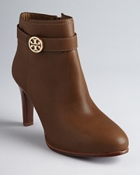 Tory Burch ups the style quotient on the basic bootie in these sleek shoes featuring almond toes, polished leather and elegant logo accents. Tory Burch ups the style quotient on the basic bootie in these sleek shoes featuring almond toes, polished leather and elegant logo accents.