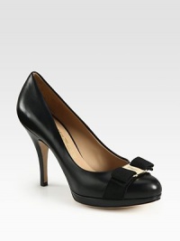 A logo-detailed grosgrain bow adorns this classic platform silhouette in fine Italian leather and glossy patent. Painted stacked heel, 4 (100mm)Patent leather platform, ½ (15mm)Compares to a 3½ heel (90mm)Leather upper with grosgrain trimLeather lining and solePadded insoleMade in Italy A logo-detailed grosgrain bow adorns this classic platform silhouette in fine Italian leather and glossy patent. Painted stacked heel, 4 (100mm)Patent leather platform, ½ (15mm)Compares to a 3½ heel (90mm)Leather upper with grosgrain trimLeather lining and solePadded insoleMade in Italy
