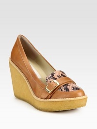 An adjustable buckle strap tops this faux leather and faux python design, with a rubber wedge for traction. Rubber wedge, 3¾ (95mm)Rubber platform, 1¼ (30mm)Compares to a 2½ heel (65mm)Faux leather upperFaux leather liningRubber solePadded insoleMade in SpainOUR FIT MODEL RECOMMENDS ordering one half size up as this style runs small. An adjustable buckle strap tops this faux leather and faux python design, with a rubber wedge for traction. Rubber wedge, 3¾ (95mm)Rubber platform, 1¼ (30mm)Compares to a 2½ heel (65mm)Faux leather upperFaux leather liningRubber solePadded insoleMade in SpainOUR FIT MODEL RECOMMENDS ordering one half size up as this style runs small.