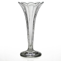 Made entirely from hand, each piece of William Yeoward Crystal draws its inspiration from antique crystal pieces originally made in England during the 18th and early 19th centuries. Small, flat cuts run from the base to the scalloped rim of this delicate vase.