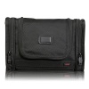 Crafted from Tumi's signature ballistic nylon, this versatile travel kit offers great organization for your toiletries when you're on the road. It hangs from virtually any fixture or can sit on the counter. Features numerous interior and two exterior pockets.