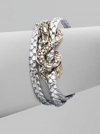 From the Naga Collection. A braid of rich leather wraps the wrist three times while weaving in and out of a curvaceous silver dragon.LeatherSterling silverLength, about 6½Lobster claspMade in Bali From the Naga Collection. A braid of rich leather wraps the wrist three times while weaving in and out of a curvaceous silver dragon.LeatherSterling silverLength, about 6½Lobster claspMade in Bali