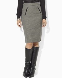 Look sophisticated and elegant at the office wearing a chic wool houndstooth pencil skirt, accented with faux-leather trim and equestrian details. Look sophisticated and elegant at the office wearing a chic wool houndstooth pencil skirt, accented with faux-leather trim and equestrian details.
