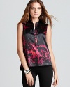 A dark palette infuses dainty florals with dramatic presence for a striking T Tahari blouse.